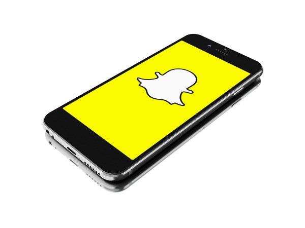 BUENOS AIRES, ARGENTINA - SEPTEMBER 07,2016: 3d renderer image. Smartphone with Snapchat logo on the screen. Snapchat is popular a photo messaging application. isolated white background